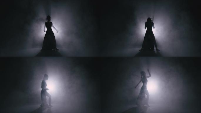 剪影舞者女人在雾中表演舞蹈人物。4k慢动作镜头。