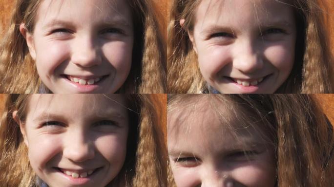 美丽的小孩的肖像，金发斜视着，凝视着幸福的景象。孩子的女性脸看着镜头大笑。带着积极情绪微笑的孩子的面
