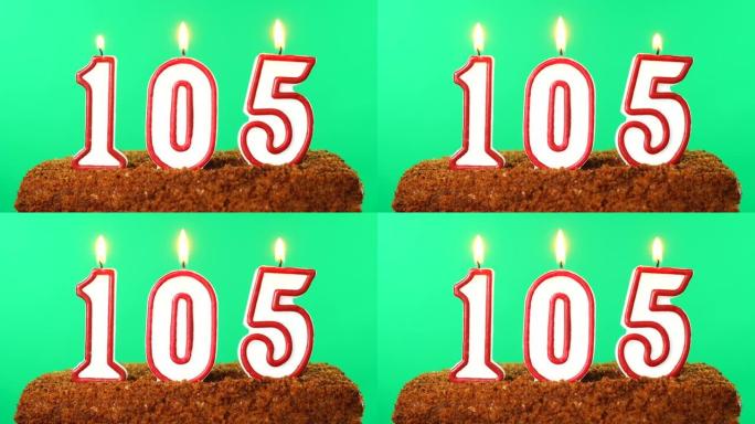 蛋糕与数字105点燃的蜡烛。色度键。绿屏。隔离