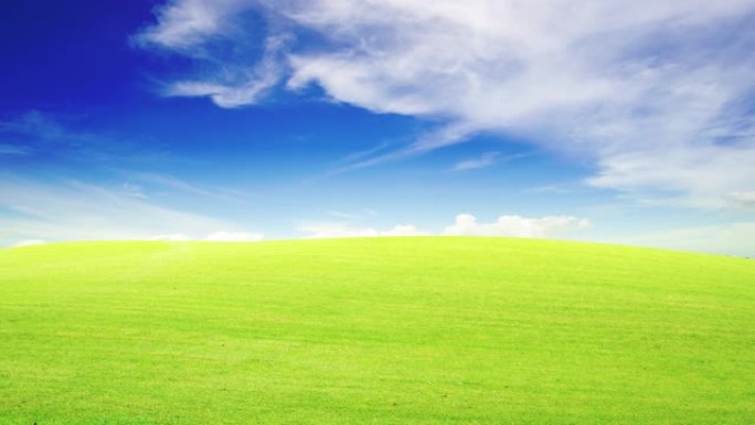 延时4K。29.97fps。镜头，美丽的绿草田和蓝天，阳光明媚的夏天风景背景