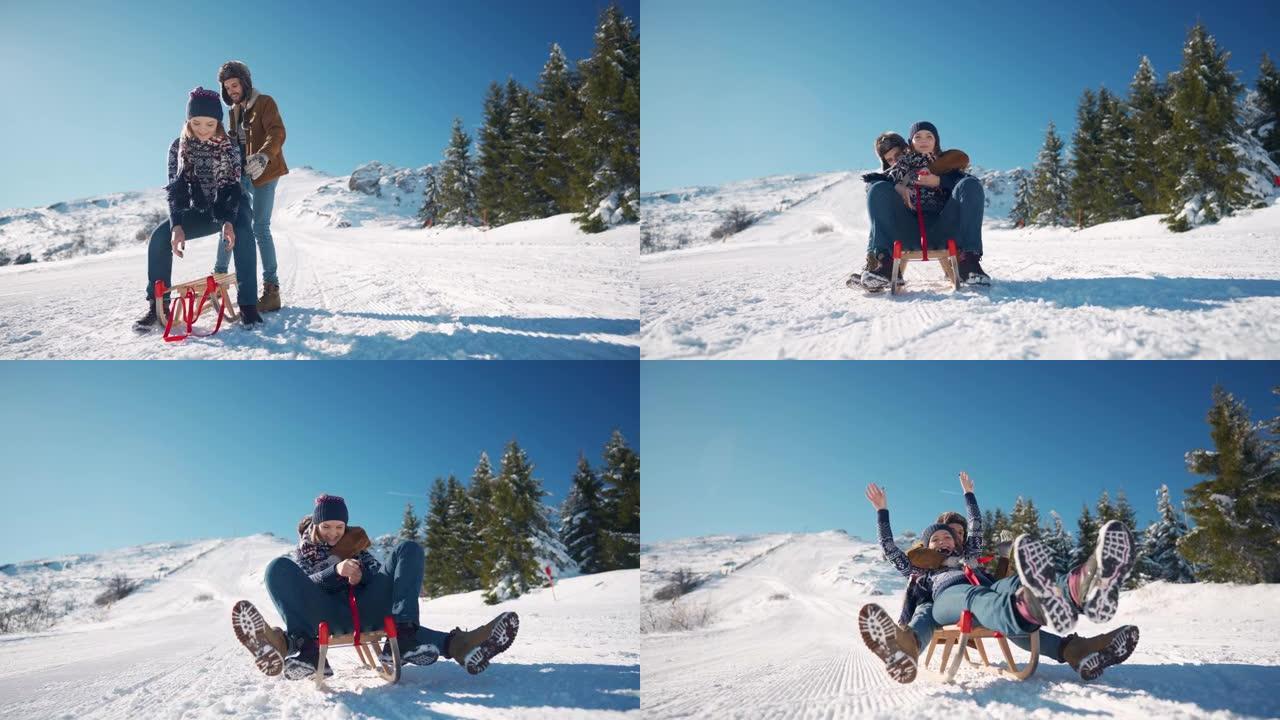 幸福的年轻夫妇在雪山上滑雪