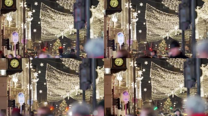 在一个繁忙的冬夜，伦敦的圣诞灯火穿过人群和交通。