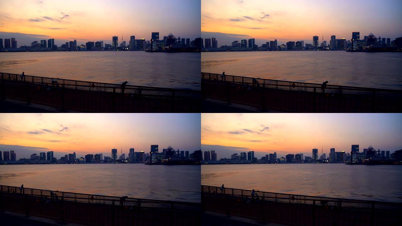 黄昏时的东京湾和彩虹桥。在公园钓鱼。