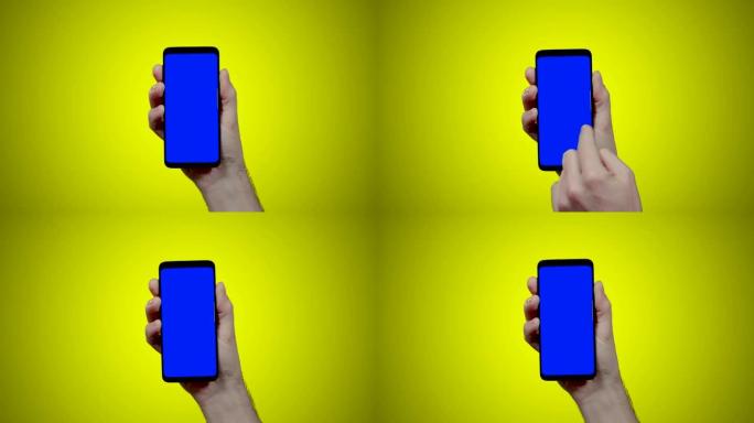 男子手持智能手机，黄色背景上有蓝色croma键，两次向右滑动