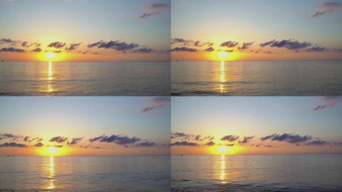 日落时分，美丽的剪影帆船在海里。公海上的三桅船浮子