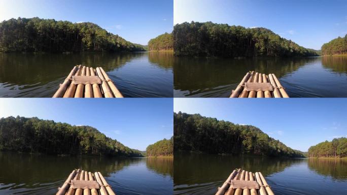 在大河中航行竹船，对抗天然树木和森林