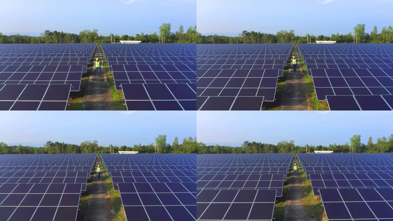 农场屋顶上有太阳能电池板或太阳能电池的工程师或工人、人的鸟瞰图。泰国拥有绿色能源、可再生能源的发电厂