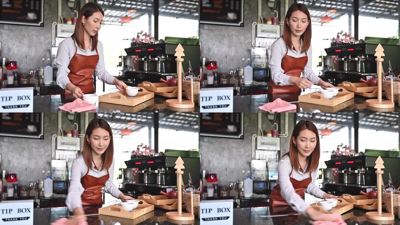 在她的小咖啡店工作的亚洲咖啡师的肖像。新的正常创业小企业