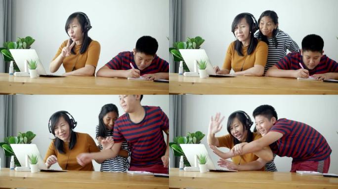亚洲妇女在新型冠状病毒肺炎期间在家工作时做视频会议。