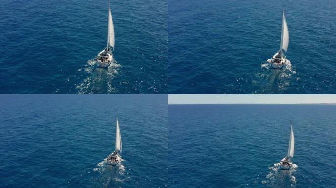 在开阔的海面上航行的游艇。帆船。游艇视频。从上面看游艇。在大风天游艇。游艇。帆船