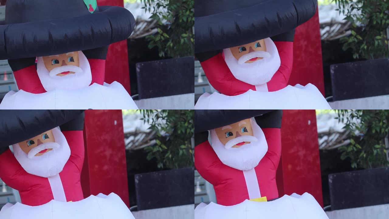 矮人木偶圣诞老人娃娃从雪地里出来，祝圣诞快乐