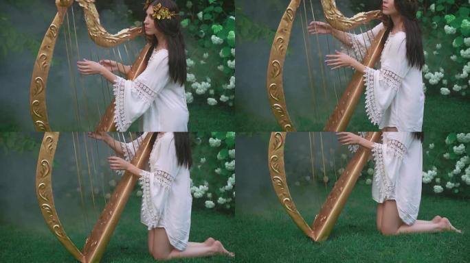 漂亮的精灵女孩玩金色老竖琴。春天开花花园里的公主。