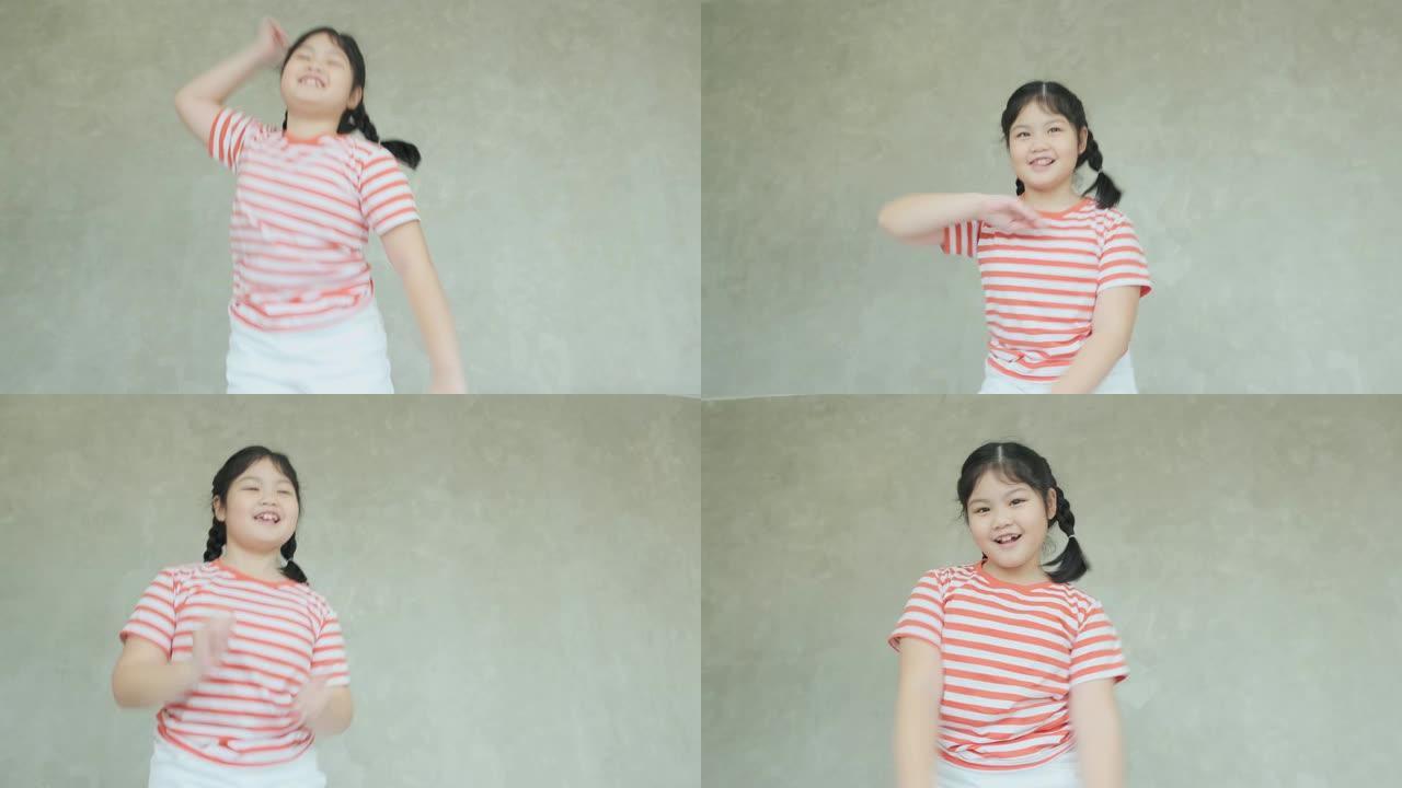 可爱漂亮的年轻亚洲女性休闲布舞跳跃和快乐唱歌白色软床4k慢动作镜头