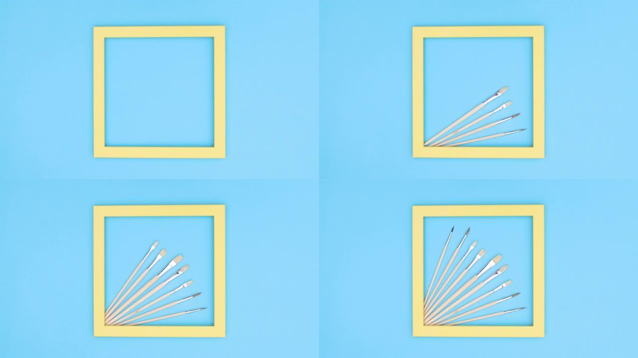 黄色框架和艺术家画笔不同大小出现在蓝色主题上。停止运动