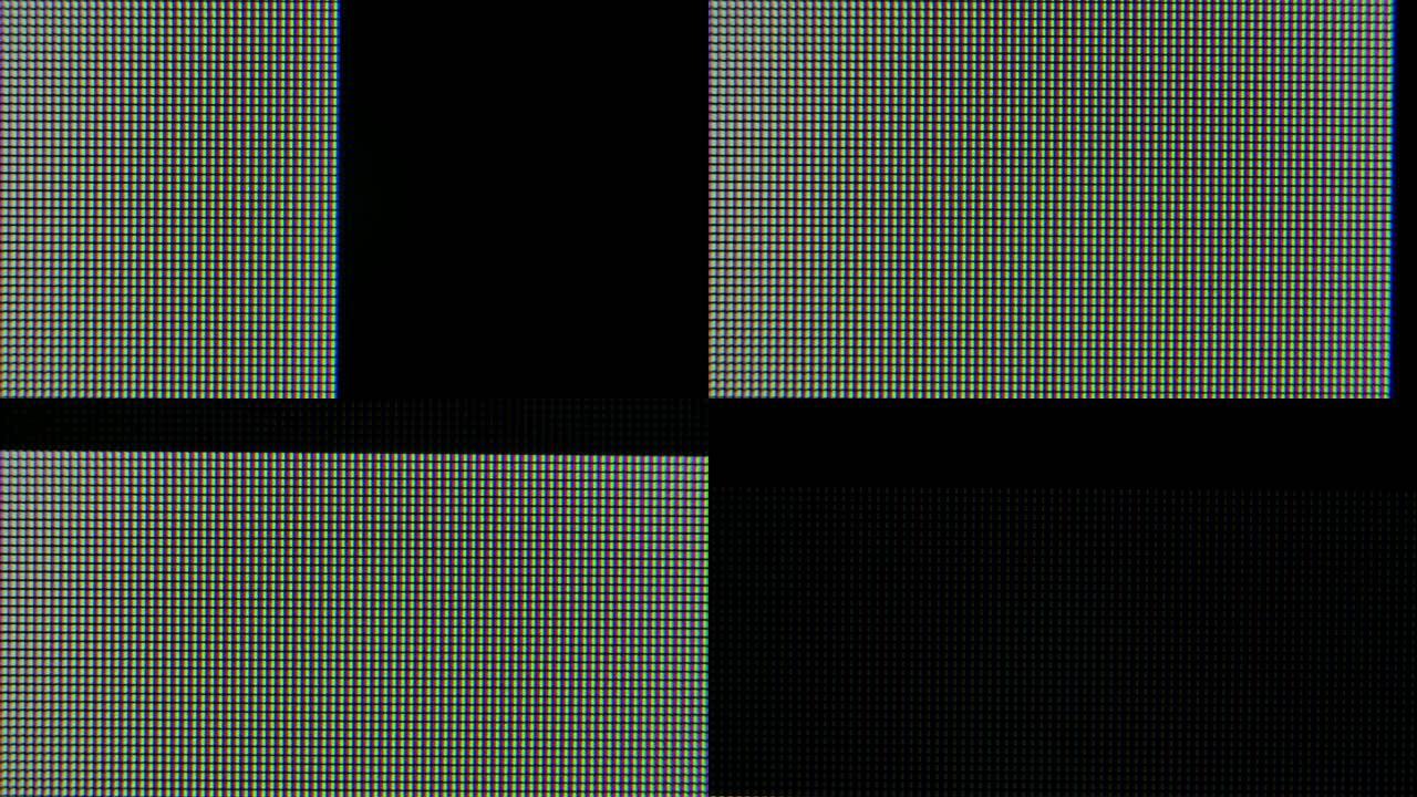 像素放大了计算机图形监视器上的红色，蓝色和绿色发光晶体和图案。像素出现，然后在屏幕上消失