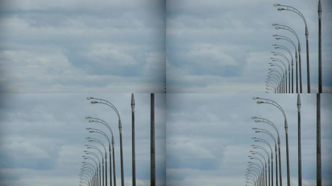 摄像机从云层移动到关闭的路灯杆