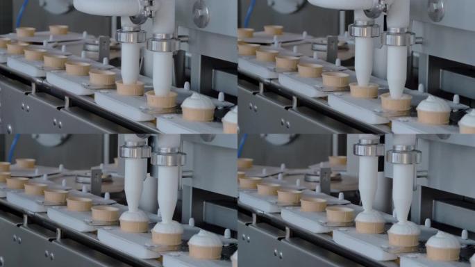 慢动作: 冰淇淋乳品厂自动灌装机，传送带