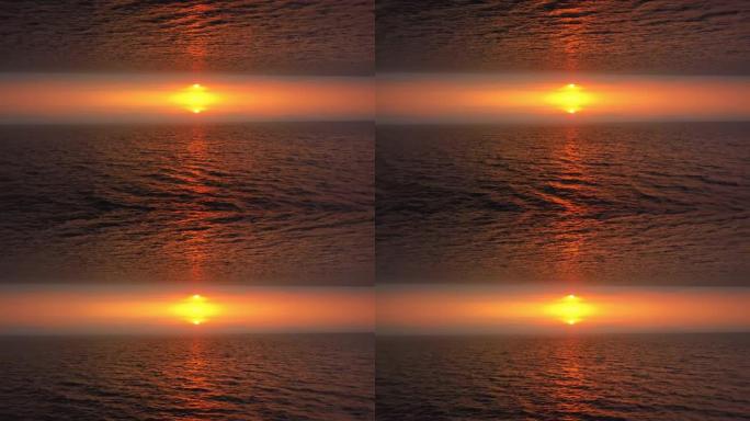 超现实颠倒镜像世界的鸟瞰图，背景为橙色太阳和大海