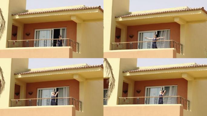 公寓。那个女人走到阳台上，把自己拉了起来。埃及。