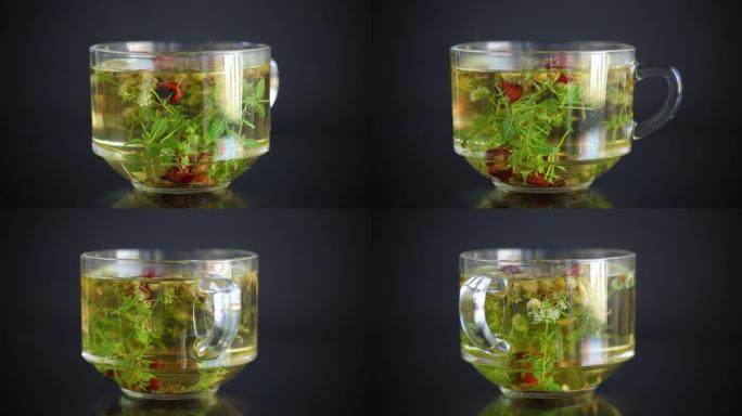 黑色背景玻璃杯中各种草药制成的热凉茶