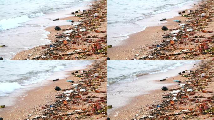 海上的日落用塑料橡胶和废物留在海滩上，海浪将它们吹入大海2