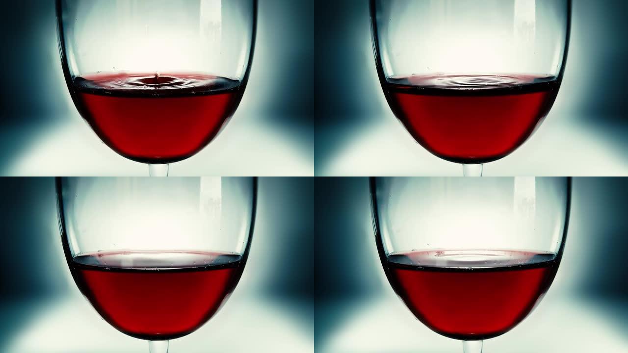 创意微距慢动作视频红酒在一杯和一滴落的酒。酒杯上慢慢落下的酒滴特写。旧复古垃圾复古风格。