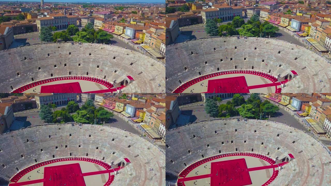意大利维罗纳竞技场的鸟瞰图。该视频是在竞技场上方拍摄的，远处可以看到维罗纳的房屋。