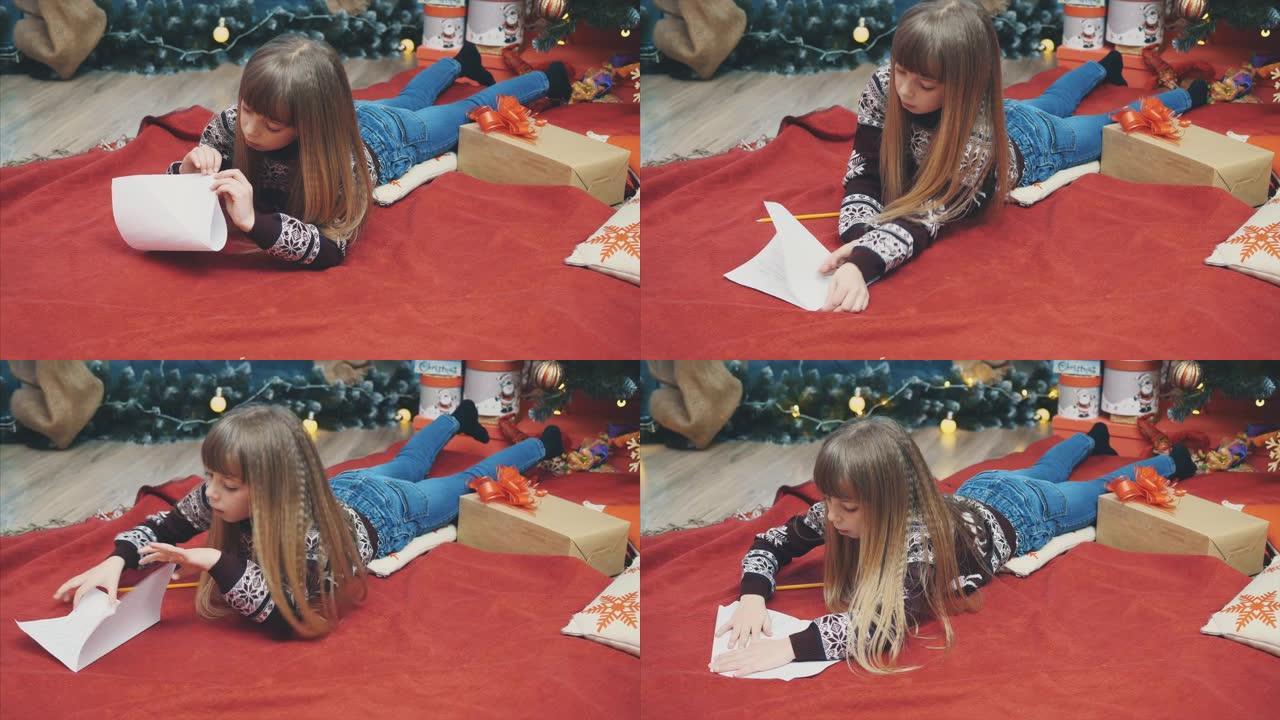 快乐女孩关闭信封，给圣诞老人的秘密信。