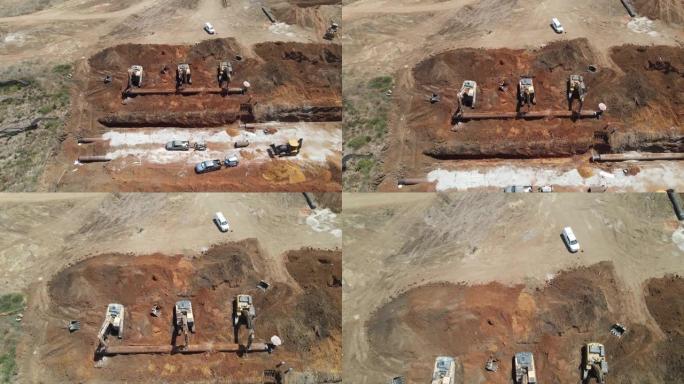 挖掘机在施工现场手持大管线，航拍