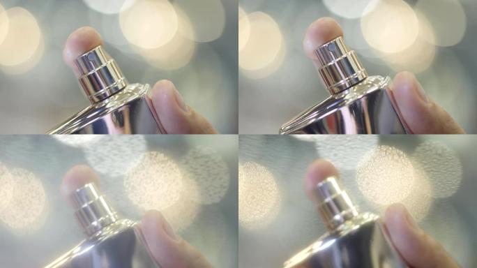 微距独家香水由女性手喷在镜片上
