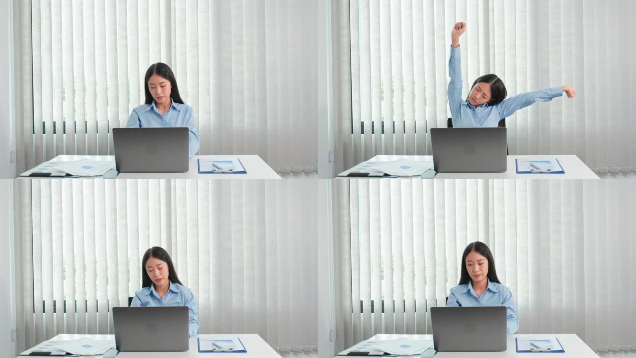 亚洲妇女因在办公室的辛勤工作而感到压力和疲倦
