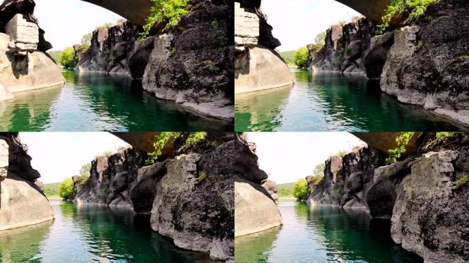 空中勘测水上，美丽的风景，在群山之中，有一个湖，一条河，一个温泉。炎热的夏日。希腊。希腊的热水