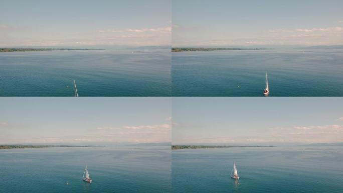 湖泊景观上的游艇恬静的湖面小帆船行驶在湖