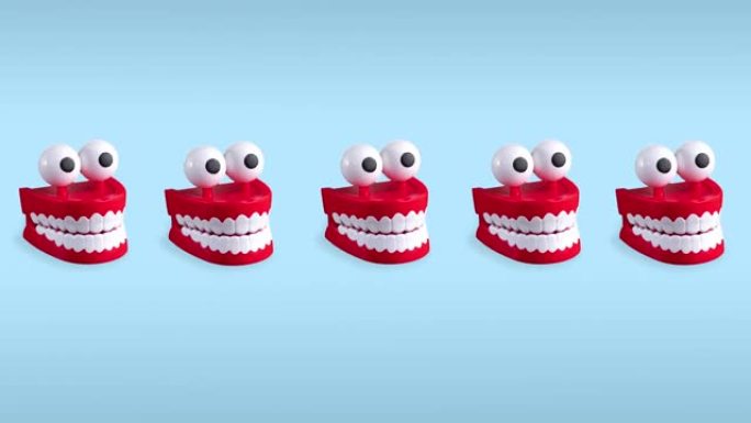 无缝循环有趣的动画颤抖的牙齿玩具与蓝色柔和的背景大眼睛。塑料红色的嘴与白色的尖牙是一个概念的口腔卫生
