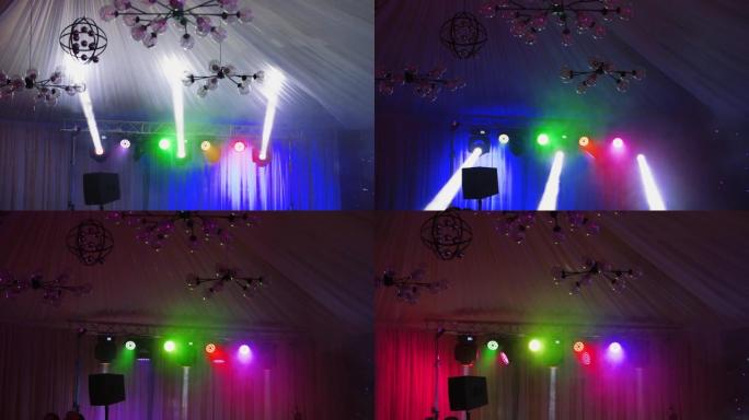 舞台上的专业照明设备。音乐舞蹈表演的中央场景发出明亮的激光和光线。
