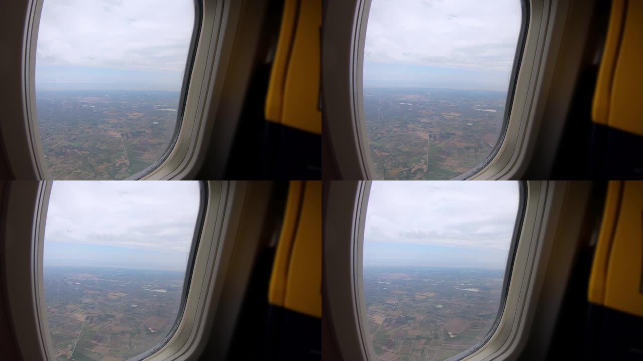 4K.前排座椅透过飞机窗户看到的领域