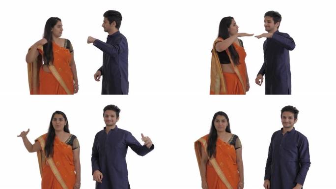 友好的印度夫妇表演问候手势的肖像。爆炸的拳头撞击。社会距离概念。孤立在白色背景上