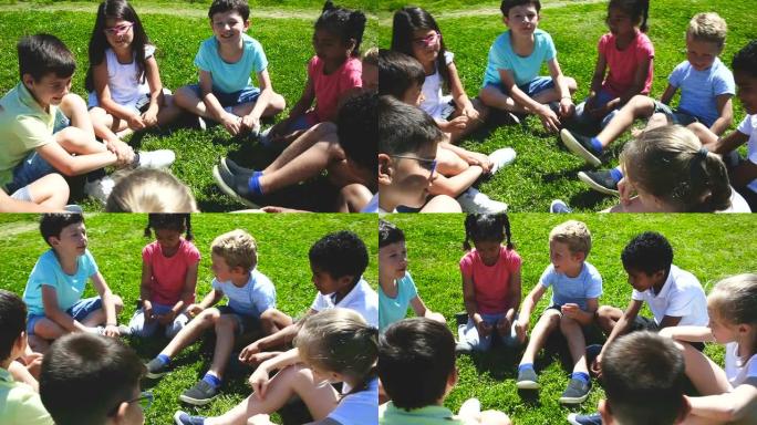 一群孩子在绿色草坪上聊天