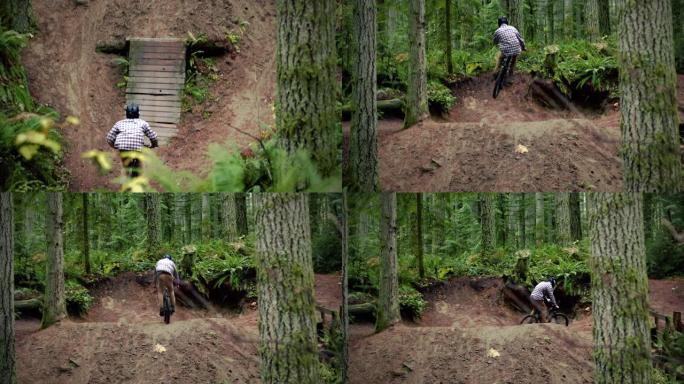 男子在泥泞的自行车上发射大空气在树林中跳跃