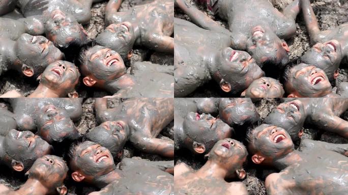 五个农村孩子，肮脏的身体躺在干燥的土壤上，一起欢笑