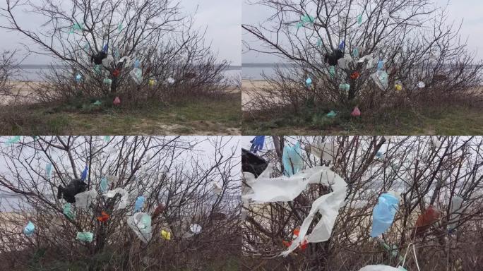 树枝上的口罩和塑料碎片。冠状病毒 (新型冠状病毒肺炎) 正在造成污染，因为废弃的口罩和塑料垃圾一起使