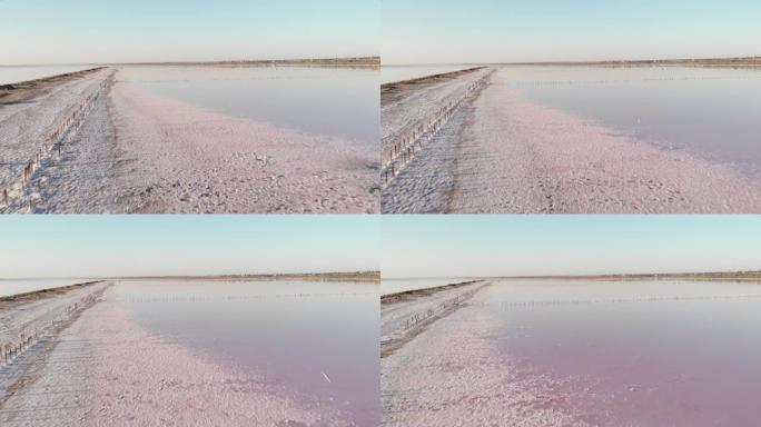 乌克兰上库亚尼克河口的结晶盐。敖德萨附近Kuyalnik limman上的旧木结构。咸干湖中的健康盐