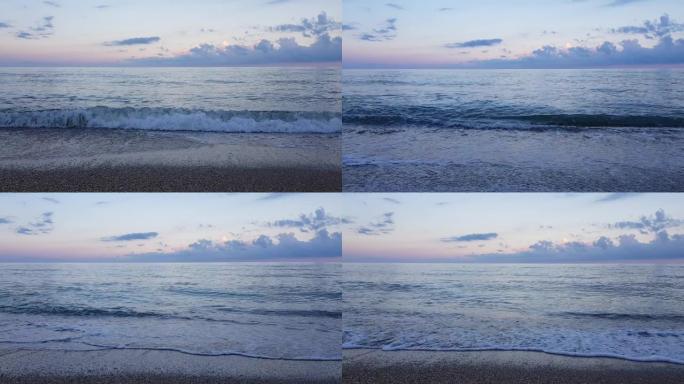 大海上的紫色日落。旅游海滨风光