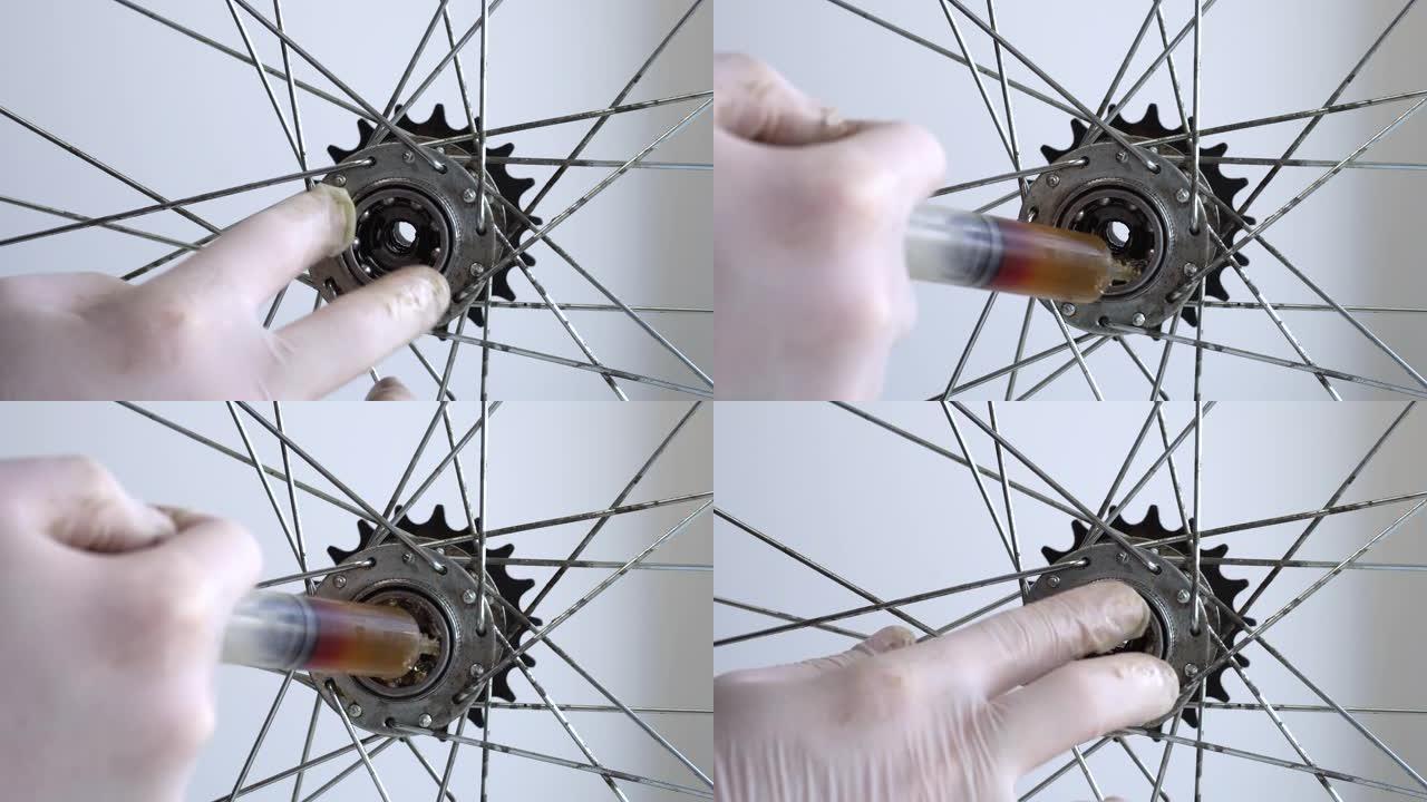 自行车车轮后套筒的组装。特写视频一名男子的手在橡胶手套中安装了一个滚珠轴承。