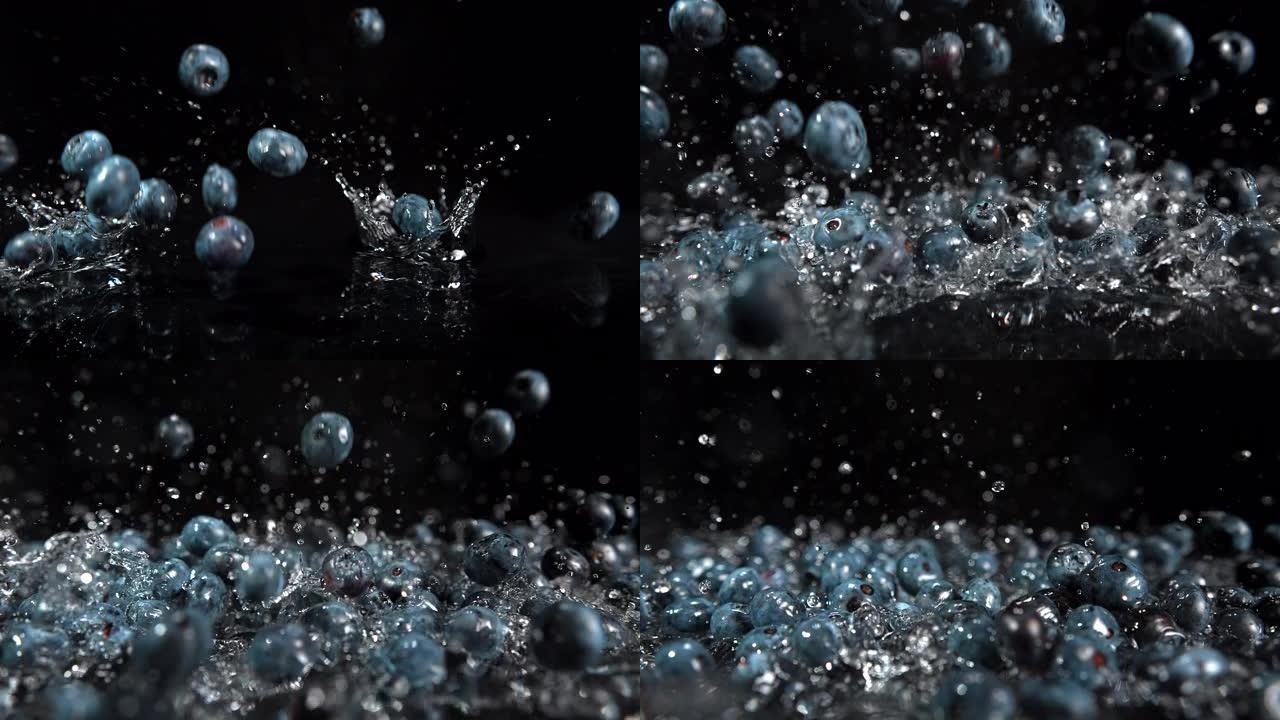 掉落的蓝莓飞溅的水滴在周围