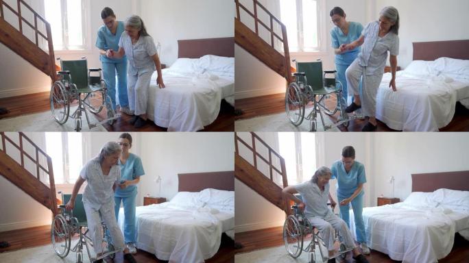 护士在疗养院帮助老年妇女坐轮椅