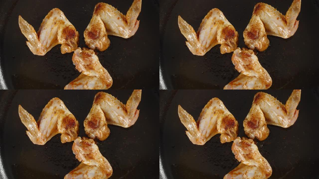 香鸡翅在油锅里煎。