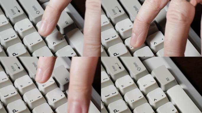 手指按下键盘上的分号或冒号按钮