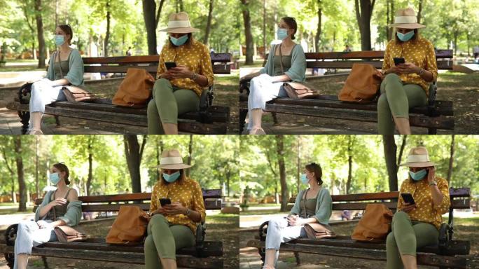 两名妇女在公园维持社会距离规则