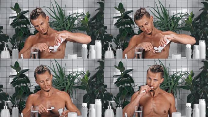 男子挤牙膏在浴室刷牙